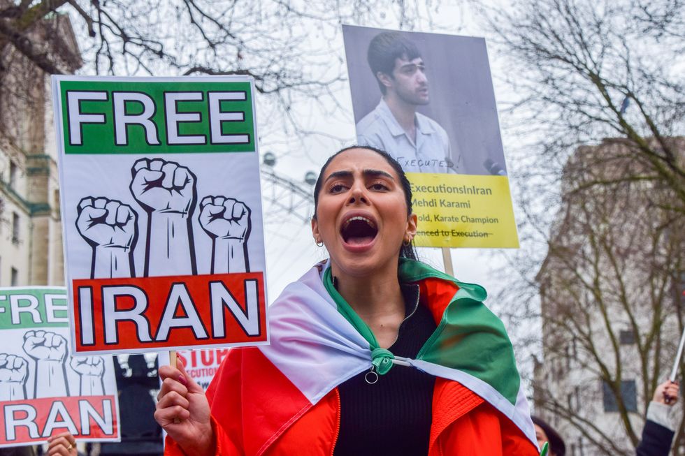 london, united kingdom 20230114 a protester holds a 'free iran' placard during the demonstration demonstrators gathered outside downing street in protest against executions in iran and in support of freedom for iran photo by vuk valcicsopa imageslightrocket via getty images