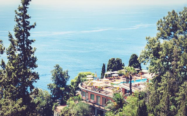 beautiful seacoast of sicily, sea view with luxury hotel resort in taormina, italy