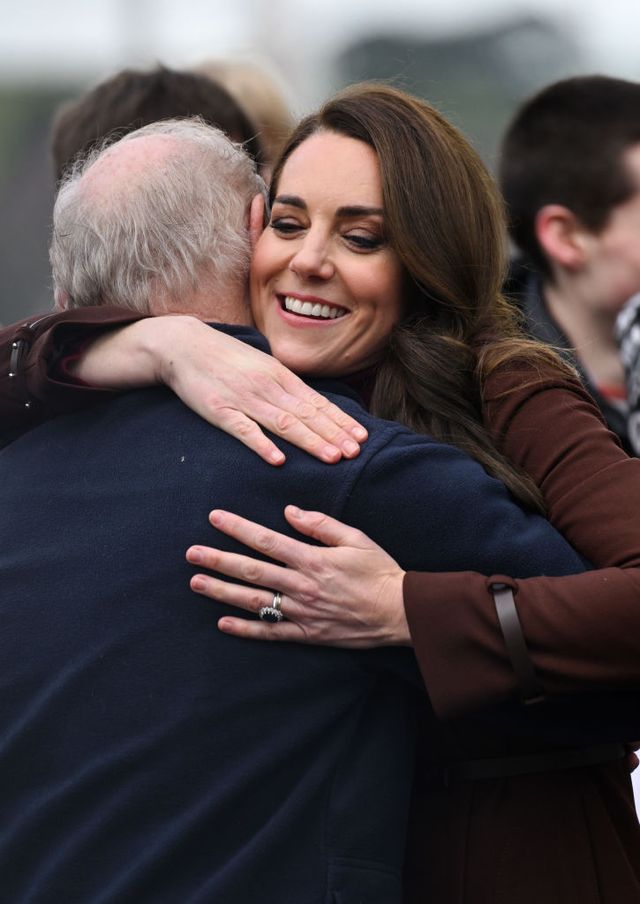 falmouth, england february 09 catherine, princess of wales hugs her former school teacher jim embury during a visit to the national maritime museum cornwall with prince william, prince of wales on february 09, 2023 in falmouth, england their royal highnesses are visiting cornwall for the first time since becoming the duke and duchess of cornwall photo by karwai tangwireimage