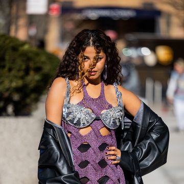 new york, new york february 11 a guest wears cut out dress, black leather jacket outside area during new york fashion week on february 11, 2023 in new york city photo by christian vieriggetty images