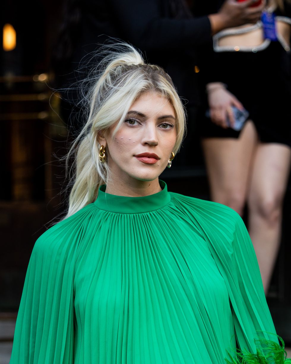 new york, new york february 11 devon windsor wears green pleated fringed dress, knee high boots outside patbo during new york fashion week on february 11, 2023 in new york city photo by christian vieriggetty images