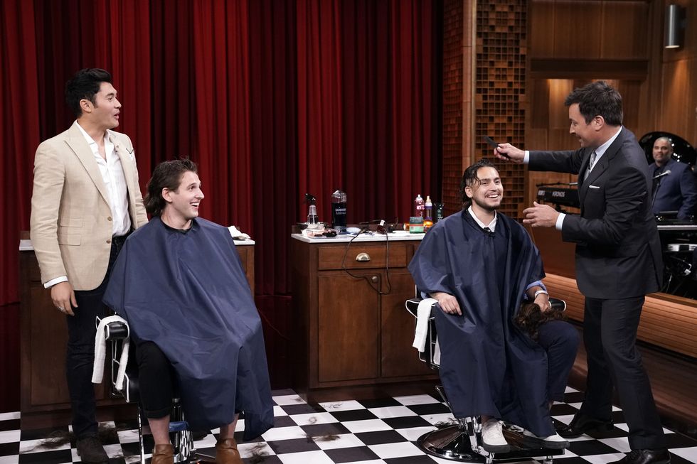 the tonight show starring jimmy fallon episode 1107 pictured l r actor henry golding and host jimmy fallon give audience members haircuts on august 13, 2019 photo by andrew lipovskynbcu photo banknbcuniversal via getty images via getty images