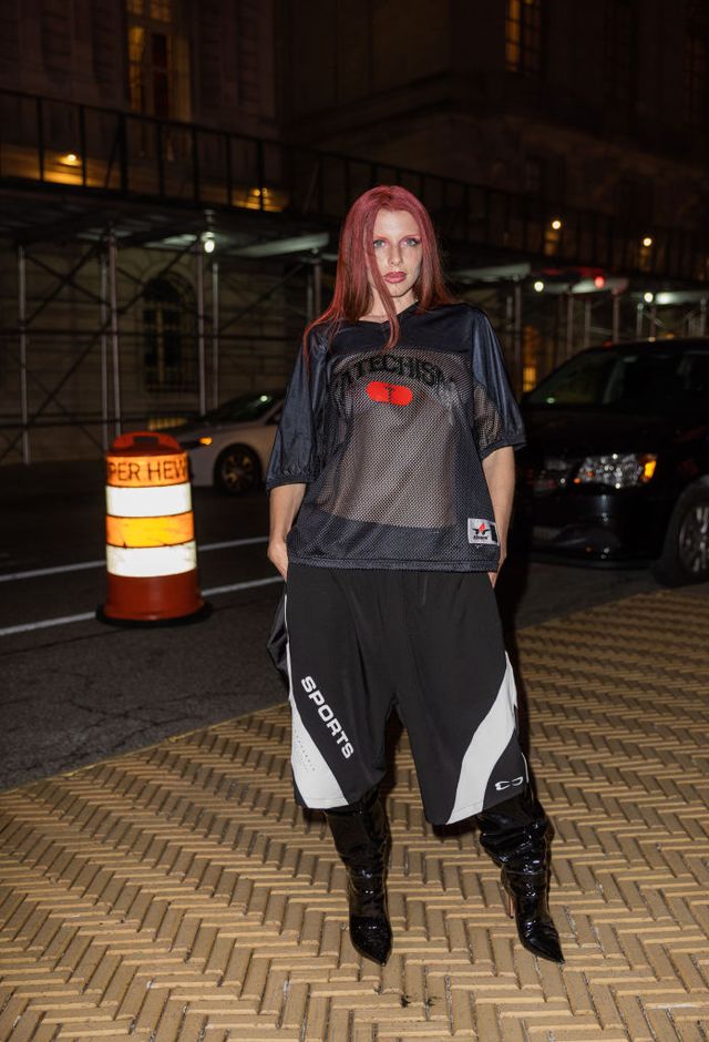 new york, new york february 15 julia fox wears transparent see trough sports jersey, wide leg sports shorts, black varnished boots outside willy chavarria new york fashion week during on february 15, 2023 in new york city photo by christian vieriggetty images