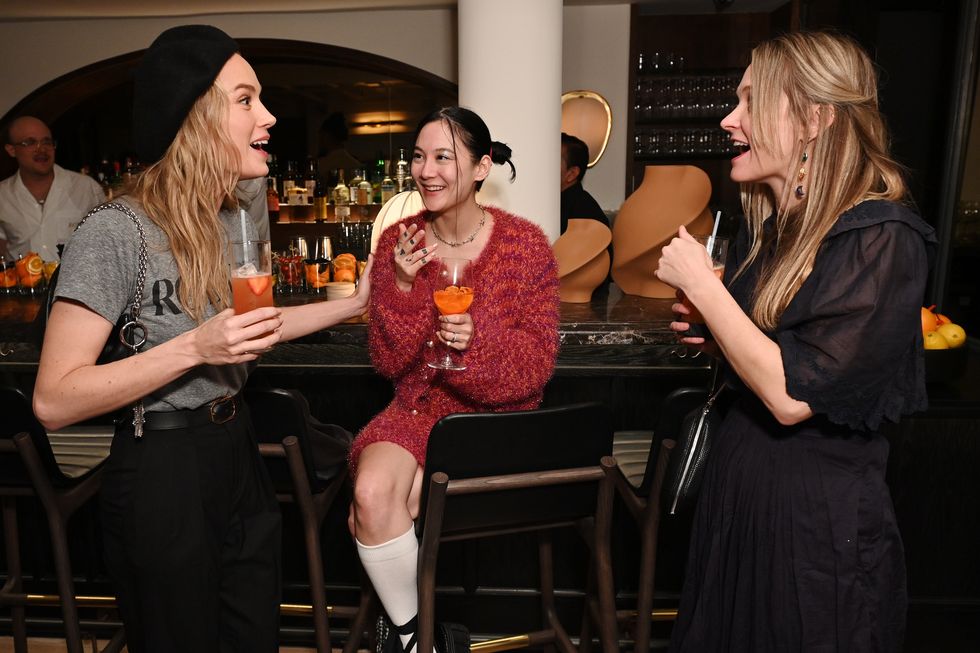 new york, new york february 10 l r brie larson, michelle zauner of japanese breakfast and guest attend dinner celebrating rodarte and nyfw the shows at jac’s on bond on february 10, 2023 in new york city photo by bryan beddergetty images for img fashion