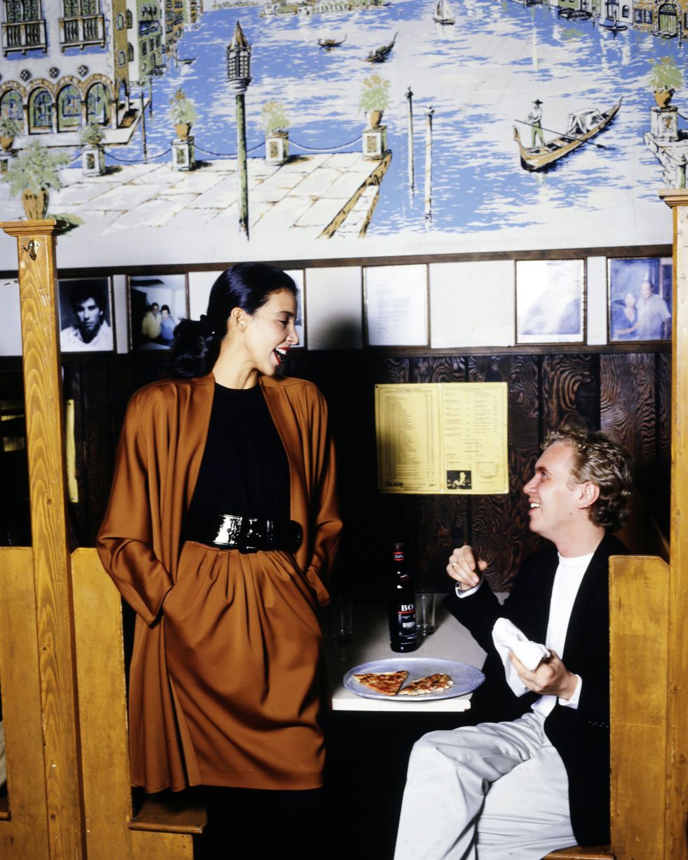 model dalma callado and designer michael kors eating pizza at johns pizzeria photo by george chinseewwdpenske media via getty images