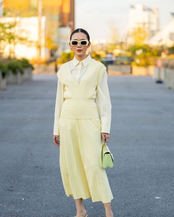 new york, new york september 12 a guest wears yellow pleated skirt, top outside cos on september 12, 2023 in new york city photo by christian vieriggetty images