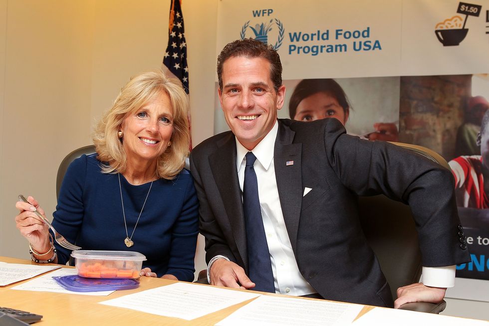 washington, dc   may 01  second lady dr jill biden and world food program usa board chair hunter biden taking the live below the line challenge, eating and drinking on 150 a day to raise awareness of global hunger and world food programme school feeding efforts around the world, at world food program usa on may 1, 2013 in washington, dc  photo by paul morigiwireimage