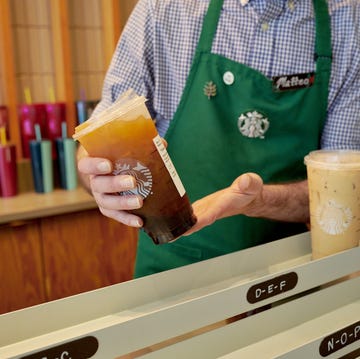 barista serving iced beverages at a starbucks barista serving iced beverages at a starbucks