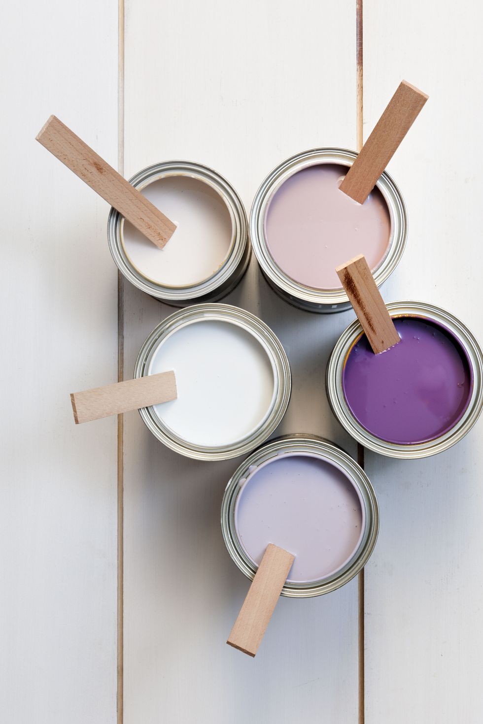 cans with purple, pink, white and lavender paint
