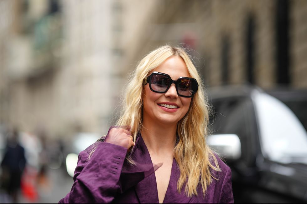 new york, new york september 10 a guest wears a dark purple full outfit, an oversized blazer jacket, sunglasses, outside jason wu, during new york fashion week, on september 10, 2023 in new york city photo by edward berthelotgetty images
