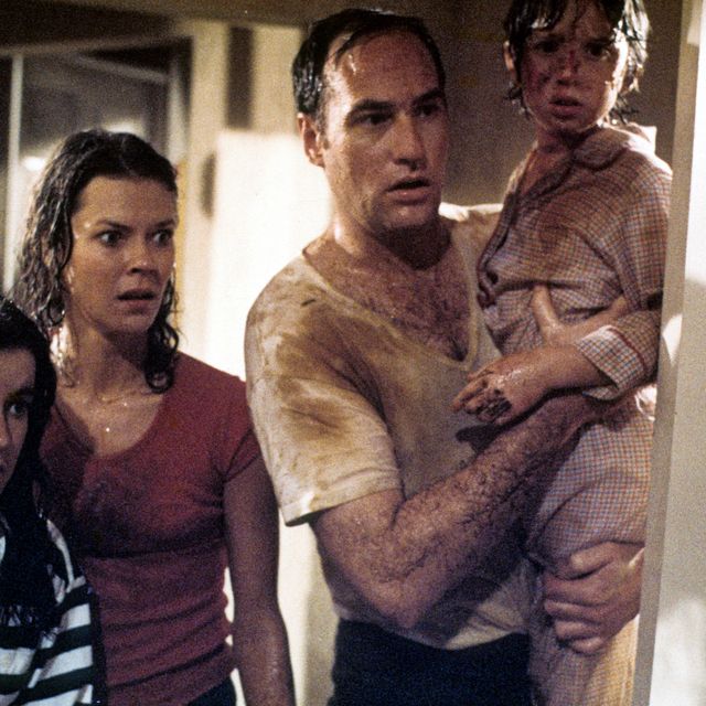 JoBeth Williams looks on as Craig T Nelson holds Oliver Robins in a scene from the film 'Poltergeist', 1982. (Photo by Metro-Goldwyn-Mayer/Getty Images)