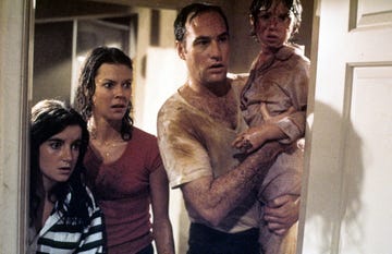 jobeth williams looks on as craig t nelson holds oliver robins in a scene from the movie poltergeist