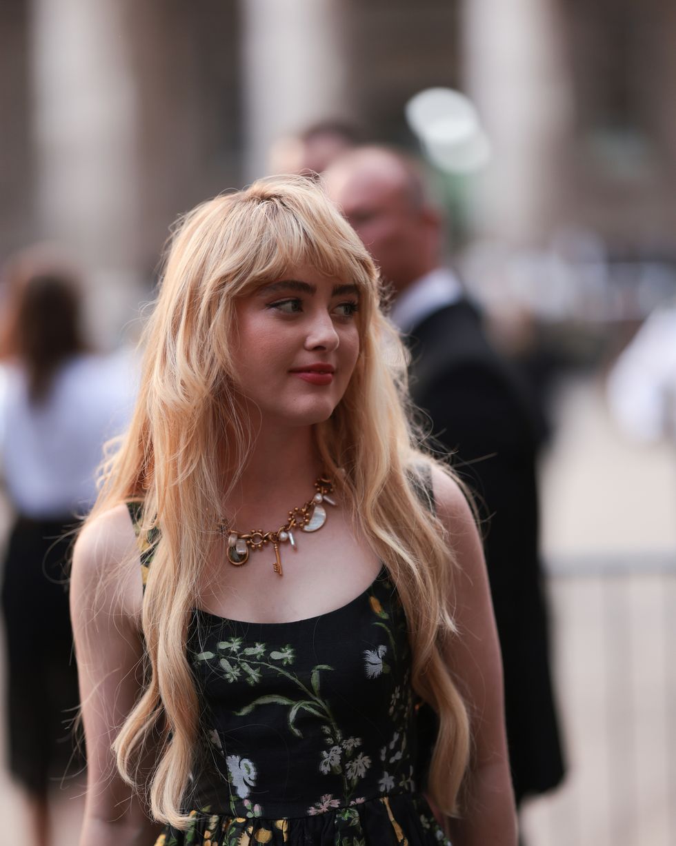 london, england september 17 kathryn newton was seen wearing a chain with stones and ornaments as well as a black dress with green and yellow flowers on it before erdem fashion show during london fashion week september 2023 at the on september 17, 2023 in london, england photo by jeremy moellergetty images