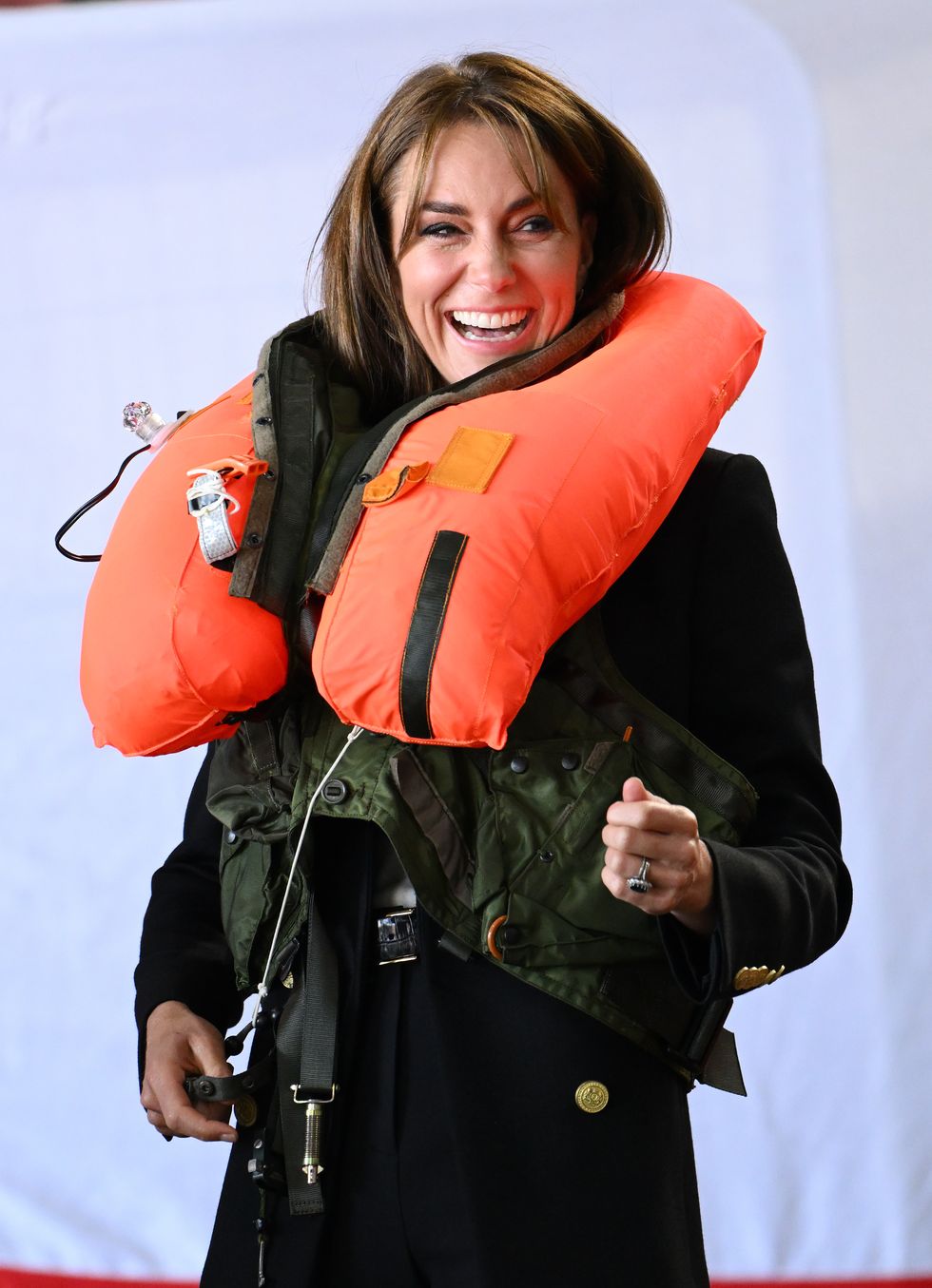 yeovil, england september 18 catherine, princess of wales inflates an emergency life preserver issued to royal navy aircrews during her visit to royal naval air station yeovilton on september 18, 2023 in yeovil, england the princess of wales is visiting the airbase following her appoint as commodore in chief, fleet air arm faa photo by karwai tangwireimage