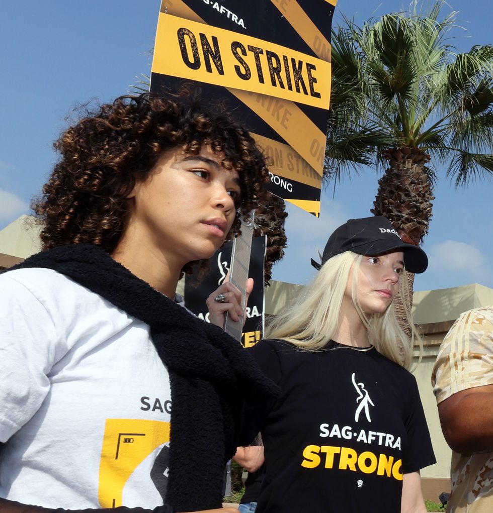 los angeles, california september 19 l r alexandra shipp and anya taylor joy join the picket line outside paramount studios on september 19, 2023 in los angeles, california members of sag aftra and wga writers guild of america have both walked out in their first joint strike against the studios since 1960 the strike has shut down a majority of hollywood productions with writers in the fourth month of their strike against the hollywood studios photo by david livingstongetty images