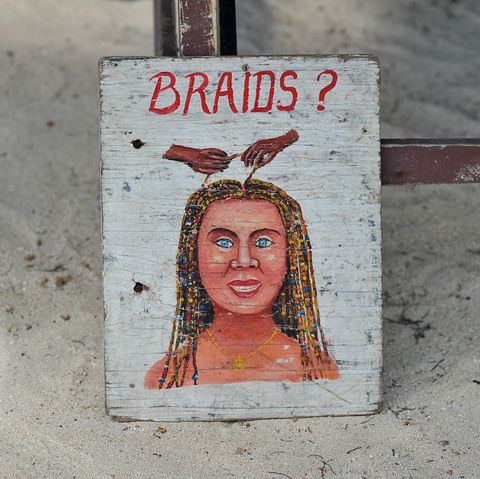 a sign for braids, a typical service provided for tourists when visiting the caribbean photo by universal educationuniversal images group via getty images