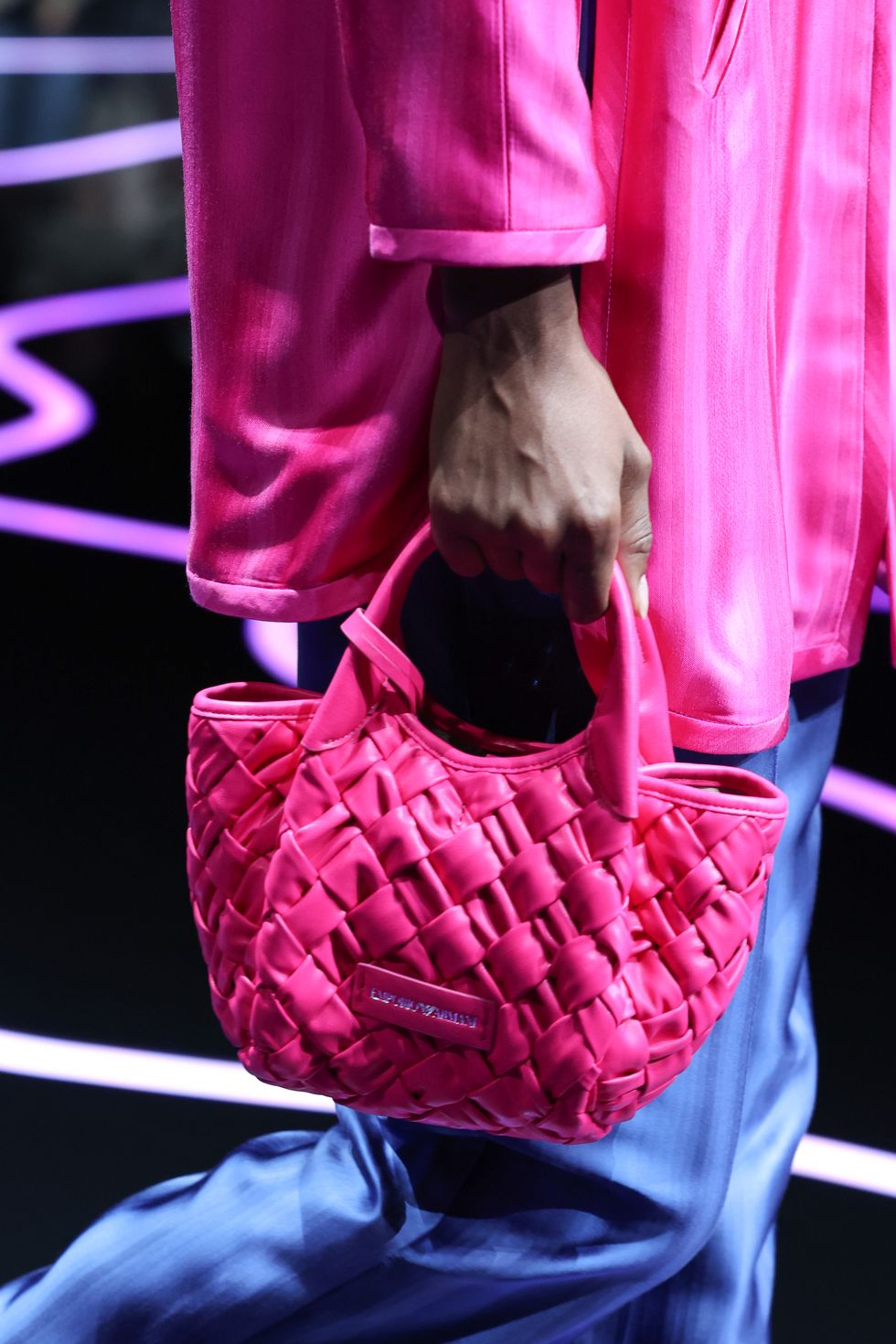 milan, italy september 21 a model, bag detail, walks the runway at the emporio armani fashion show during the milan fashion week womenswear springsummer 2024 on september 21, 2023 in milan, italy photo by pietro dapranogetty images