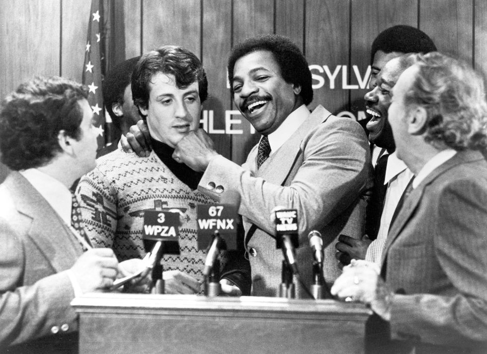 american actors sylvester stallone l and carl weathers clown together during a press conference in a still from the film, rocky, directed by john g avildsen, 1976 photo by united artistscourtesy of getty images