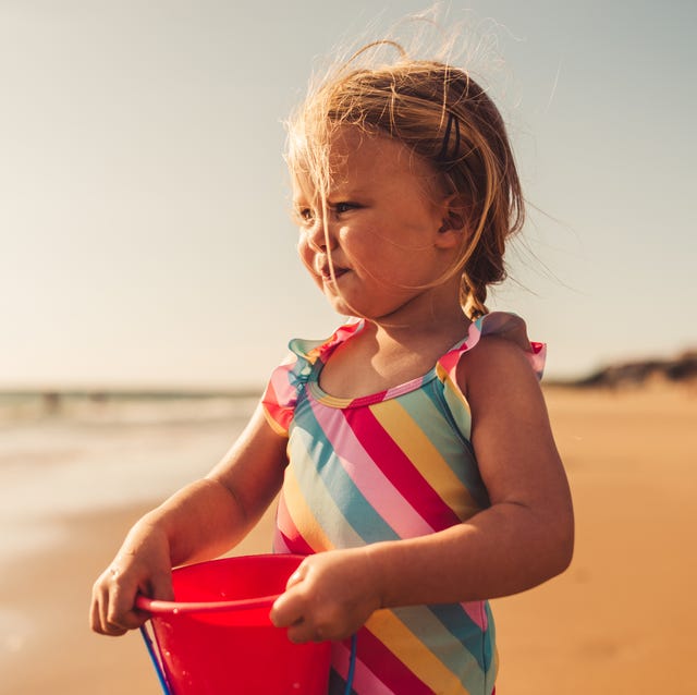 july baby names portrait of a young girl looking at the beach.