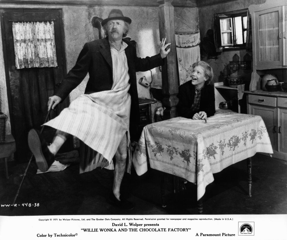 Jack Albertson dancing in front of Peter Ostrum in a scene from "Willy Wonka & the Chocolate Factory"