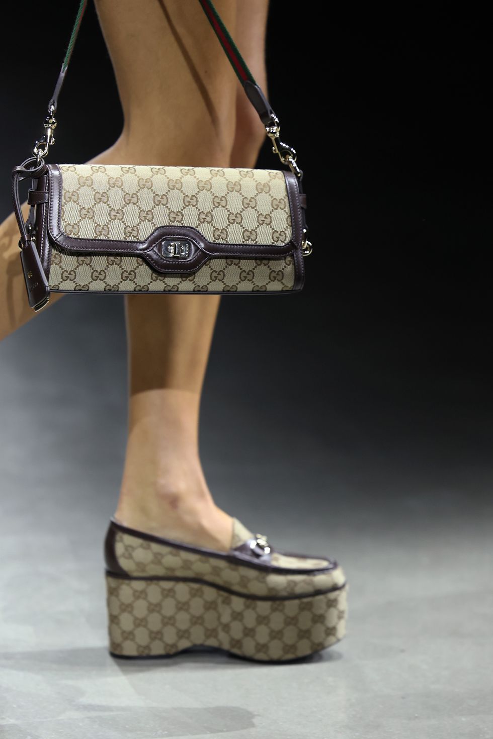 milan, italy september 22 a model, bag detail, walks the runway of gucci ancora during milan fashion week on september 22, 2023 in milan, italy photo by daniele venturelligetty images for gucci