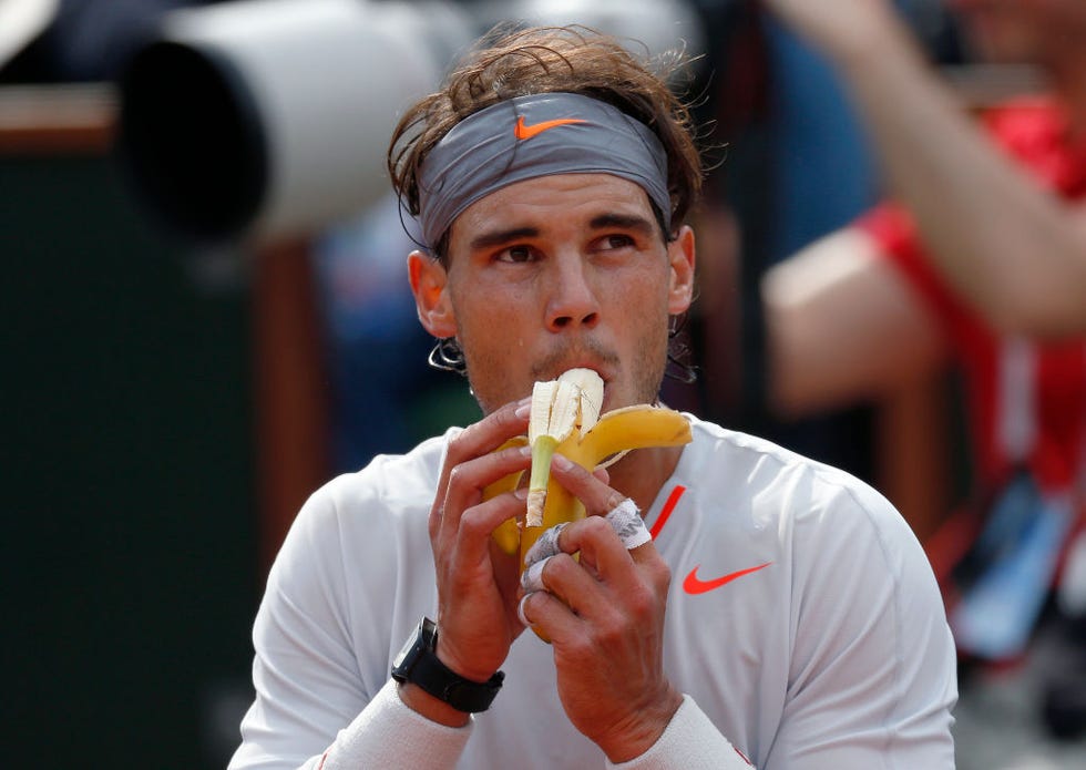 spains rafael nadal eats a banana during a time out of his  french tennis open round of sixteen match against japans nishikori kei during theirat the roland garros stadium in paris, on june 3,  2013 afp photo  thomas coex  afp photo  thomas coex        photo credit should read thomas coexafp via getty images