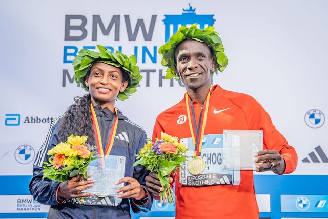 berlin, germany september 24 tigist assefa from ethiopia and eliud kipchoge from kenya celebrate their victories after the 2023 bmw berlin marathon on september 24, 2023 in berlin, germany photo by luciano limagetty images