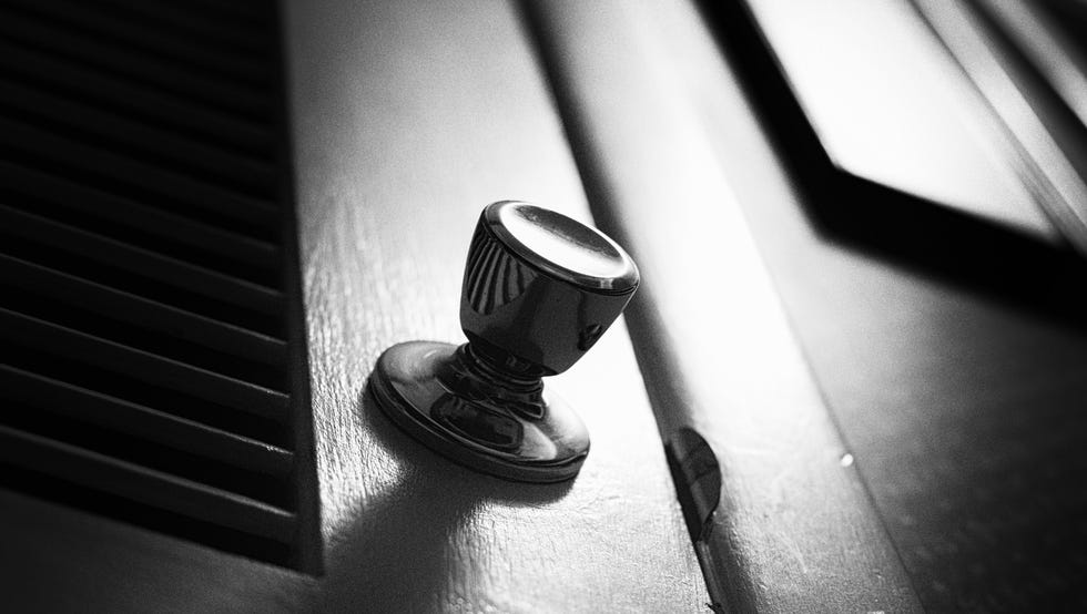 Spooky Closet Doorknob a dark, spooky grainy closet door in harsh black and white