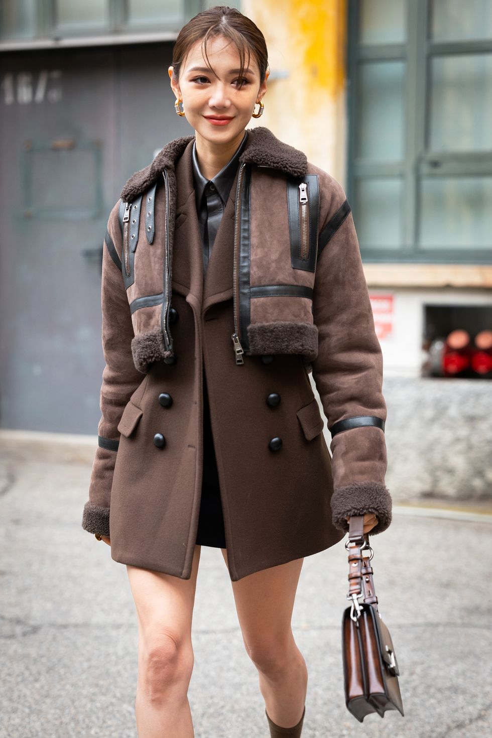 girl wearing cropped shearling jacket and wool blazer