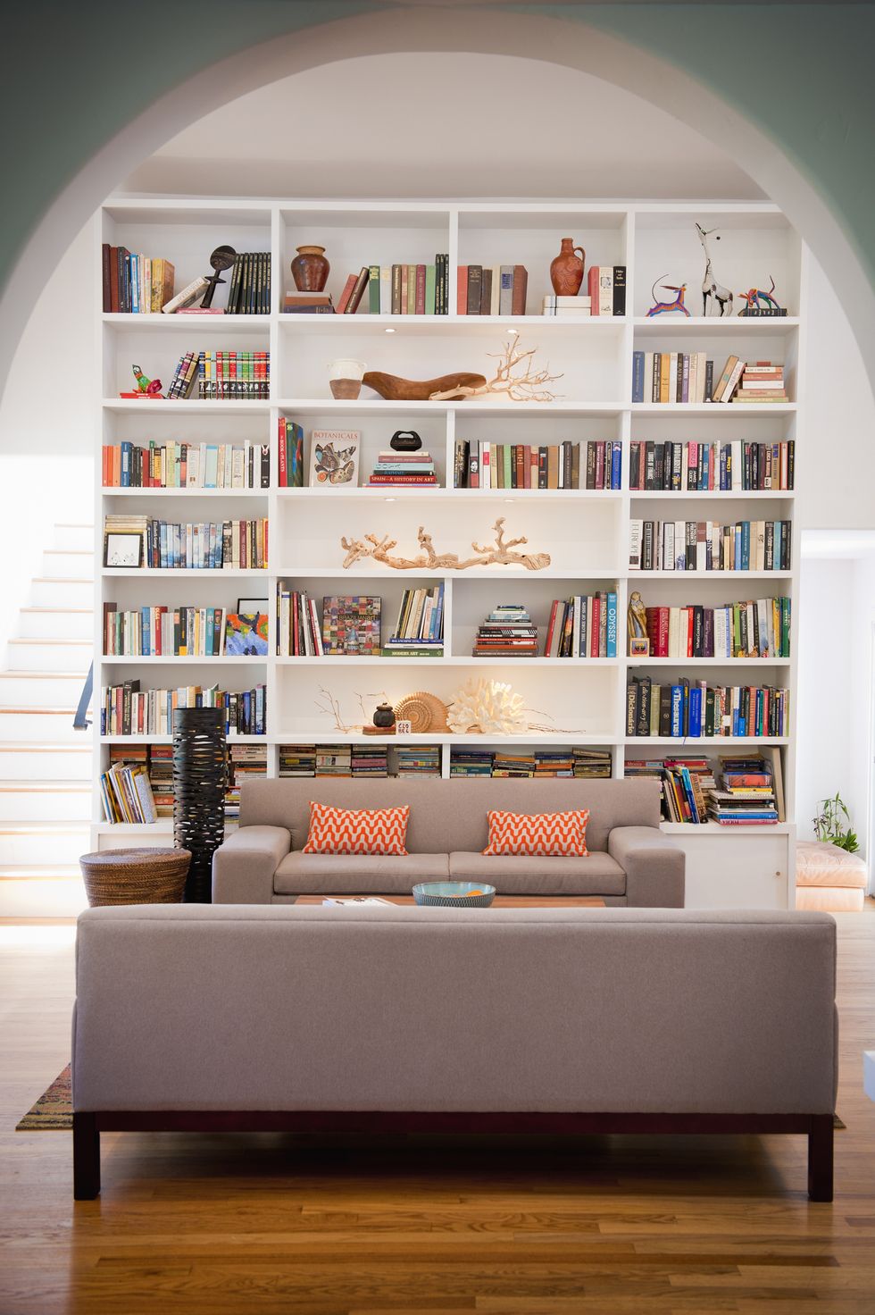 lightfilled living room with tall bookshelves