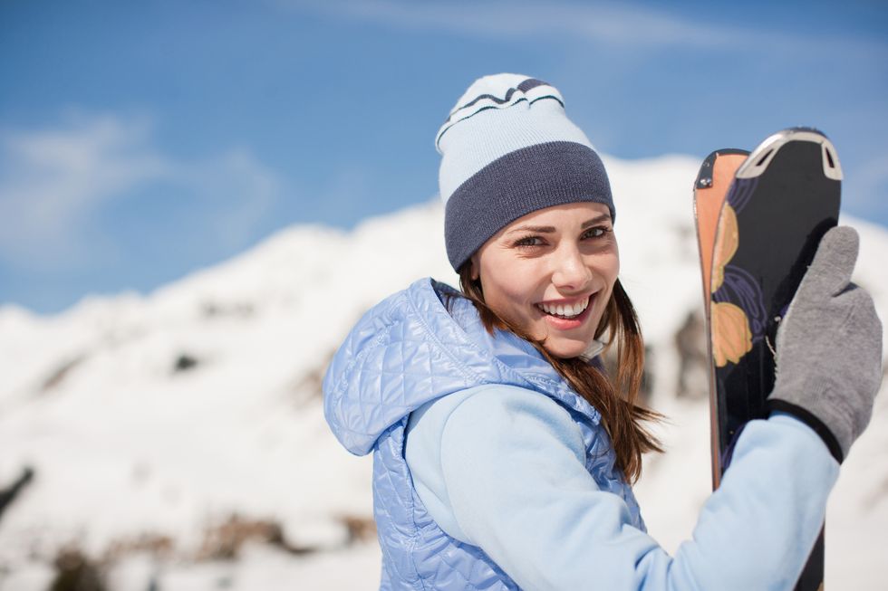 a person holding a snowboard