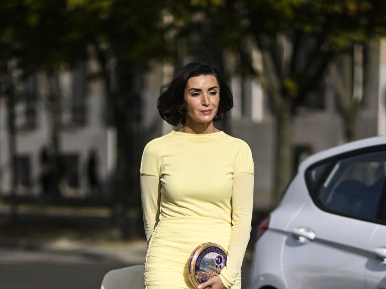 paris, france september 28 bronwyn newport is seen wearing a yellow givenchy dress, light blue heels and gold circular handbag outside the givenchy show during the womenswear springsummer 2024 as part of paris fashion week on september 28, 2023 in paris, france photo by daniel zuchnikgetty images