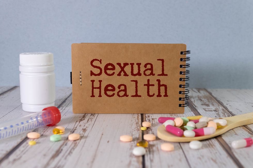 sexual health word, medical term word with medical concepts in blackboard and medical equipment