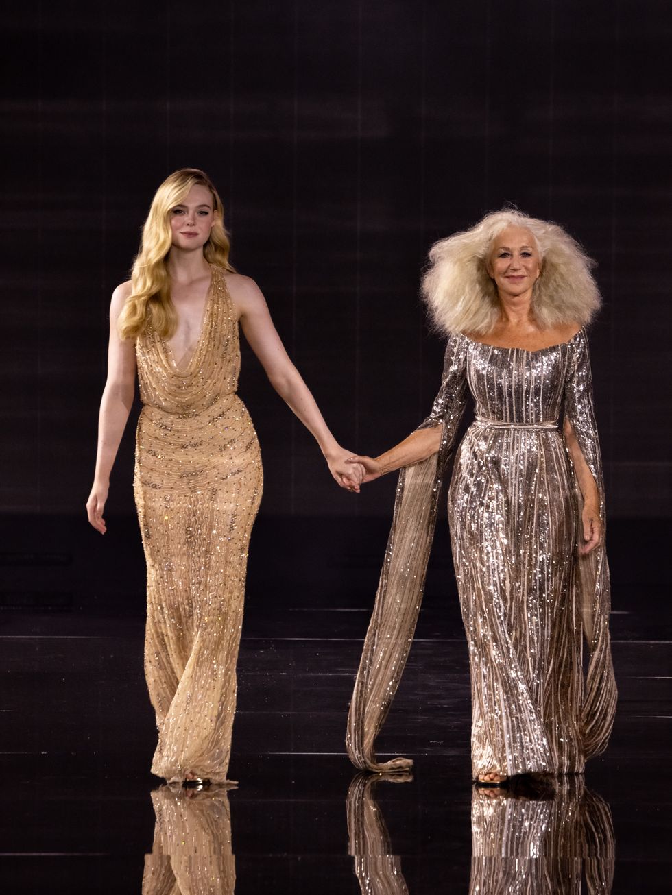 paris, france october 01 editorial use only for non editorial use please seek approval from fashion house elle fanning and dame helen mirren walks the runway during the le defile walk your worth 6th loreal show as part of paris fashion week at the eiffel tower on october 01, 2023 in paris, france photo by arnold jerockigetty images