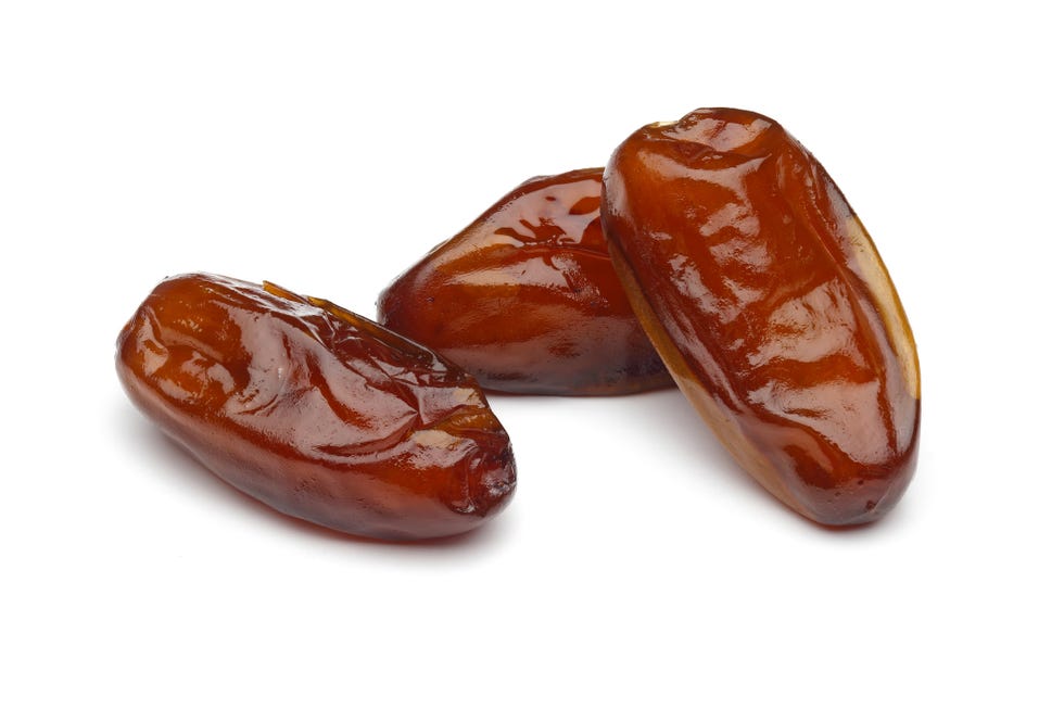 dried dates on white background