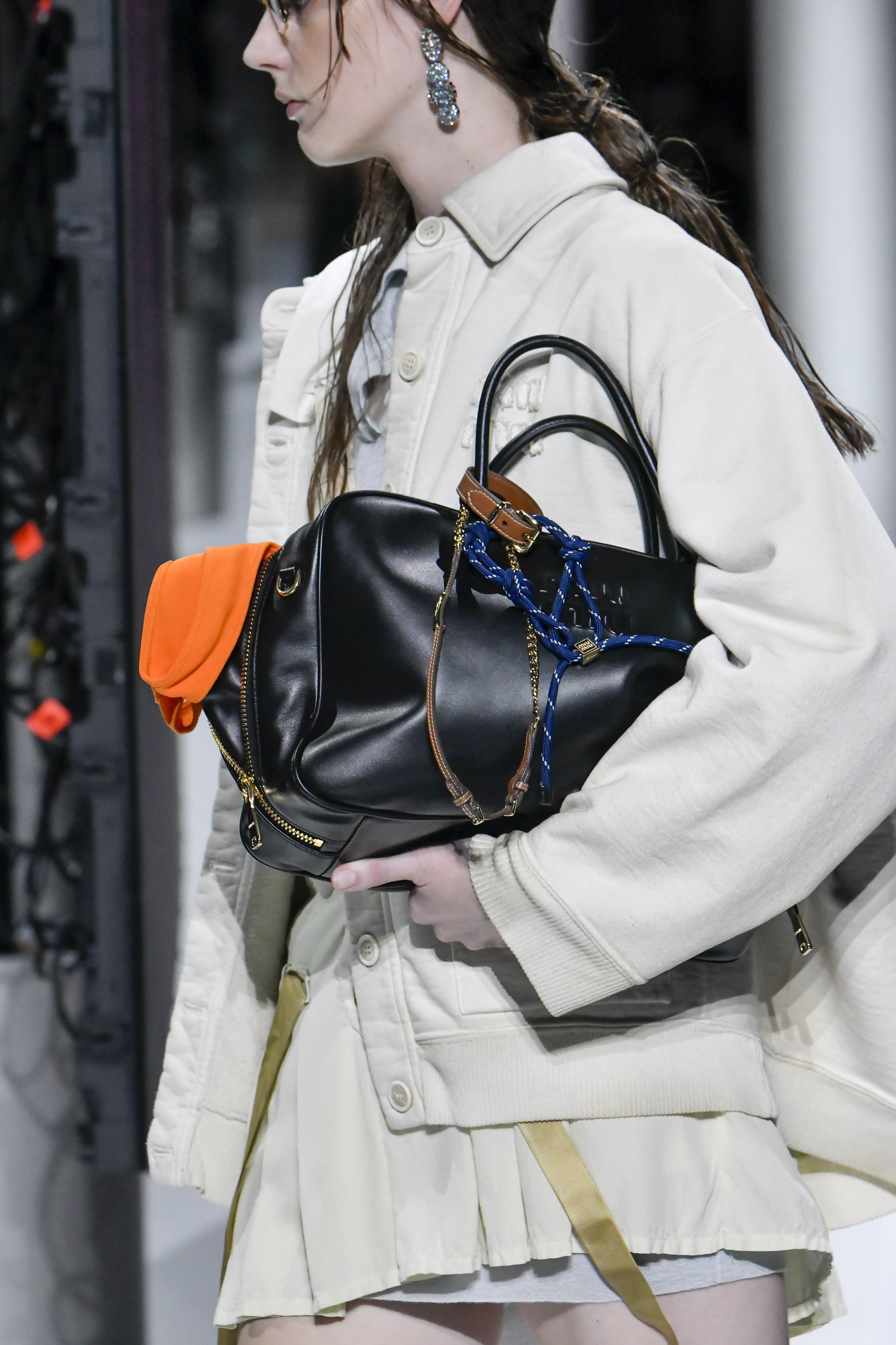 Miu Miu's Spring 2024 Models Carried Bags Stuffed With Stuff