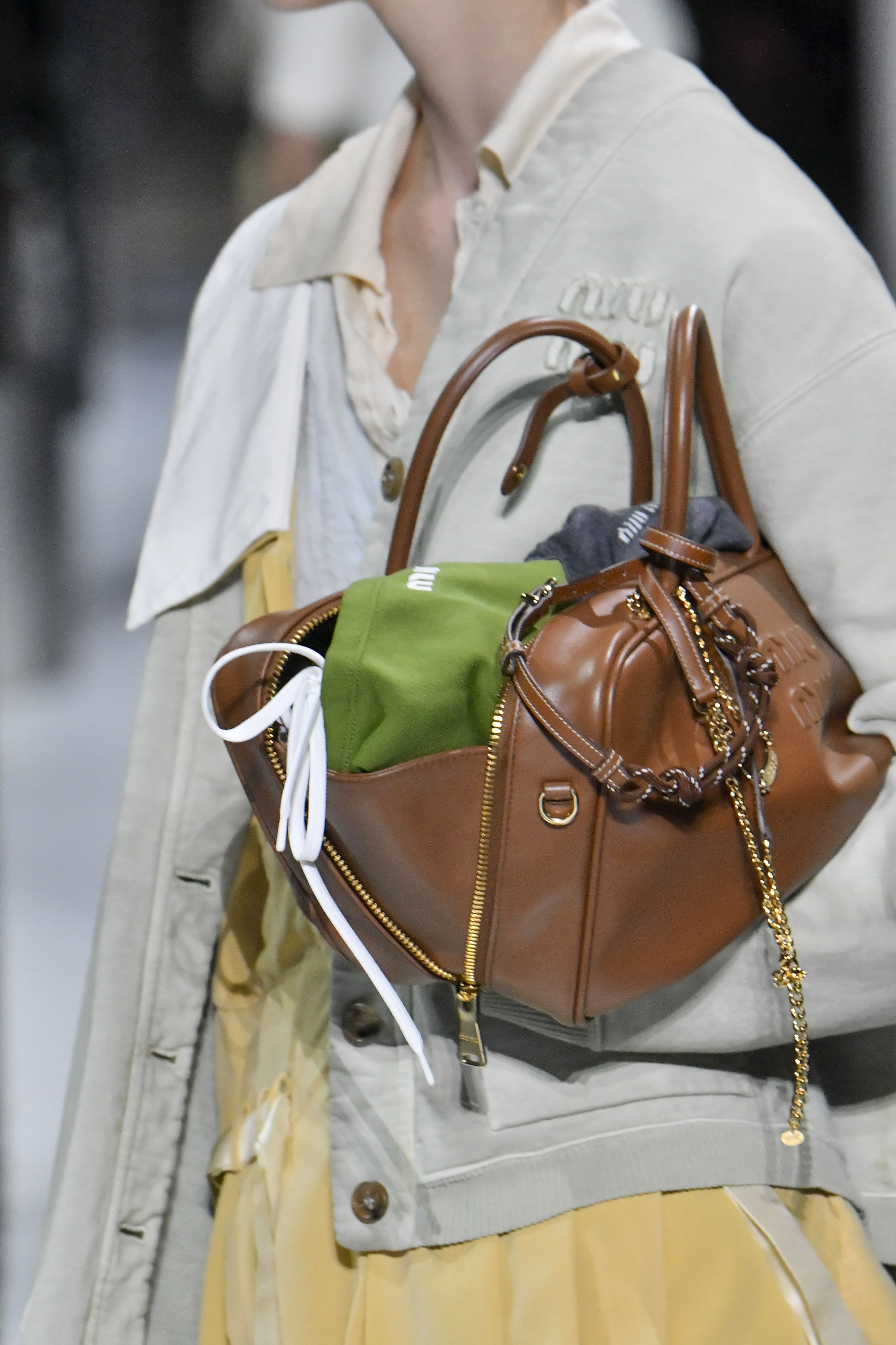 Miu Miu's Spring 2024 Models Carried Bags Stuffed With Stuff