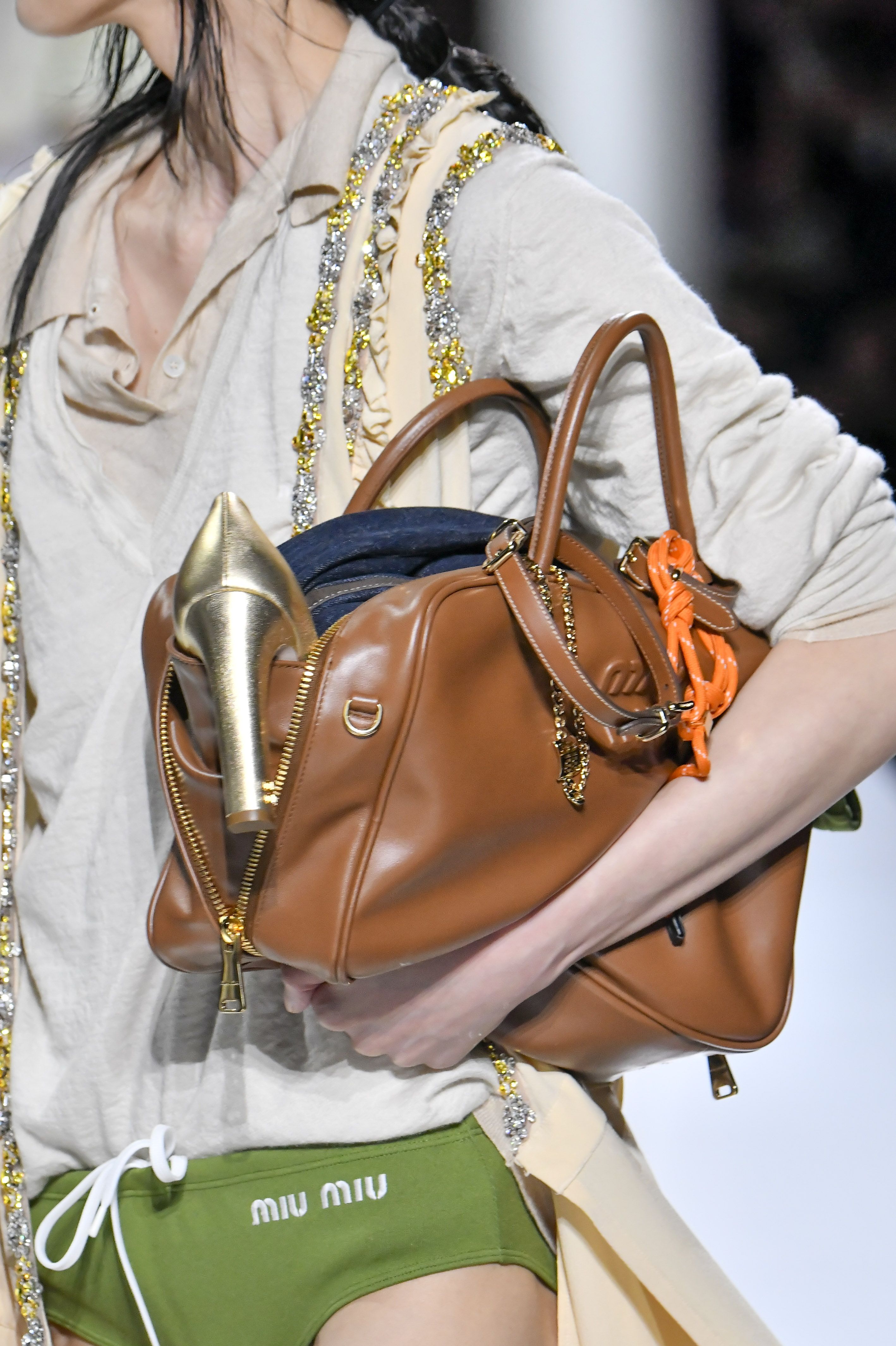 Miu Miu's Spring 2024 Models Carried Bags Stuffed With Stuff