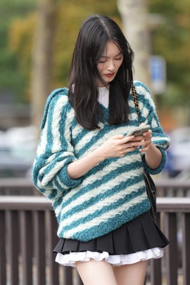 a woman looking at her phone