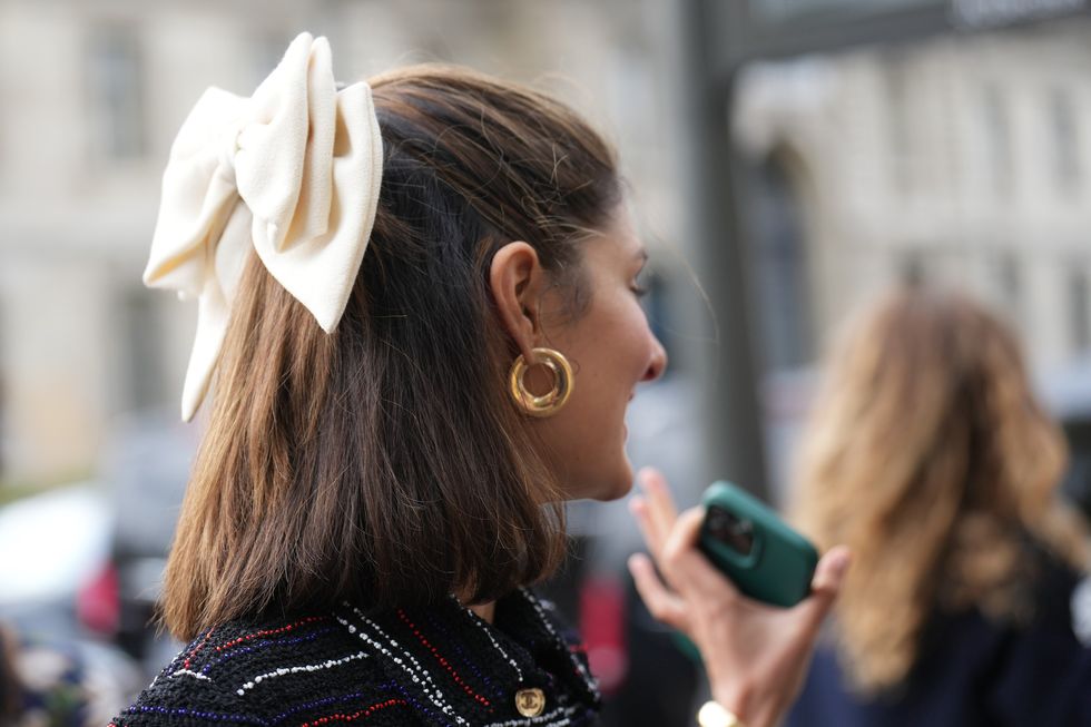 paris, france october 03 close up view of a bow tie hair detail , outside chanel, during the womenswear springsummer 2024 as part of paris fashion week on october 03, 2023 in paris, france photo by edward berthelotgetty images