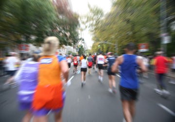 blurred view of runners at the new york city marathon