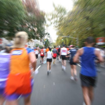blurred view of runners at the new york city marathon blurred view of runners at the new york city marathon