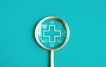 magnifying glass with medical cross