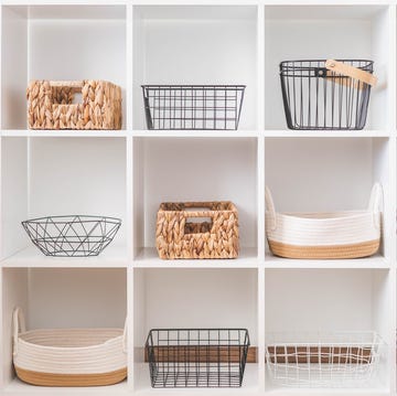 White stylish shelf in scandi style. Storage baskets. Japanese method organizer boxes set. white stylish shelf in scandi style storage baskets japanese method organizer boxes set closet organizing concept