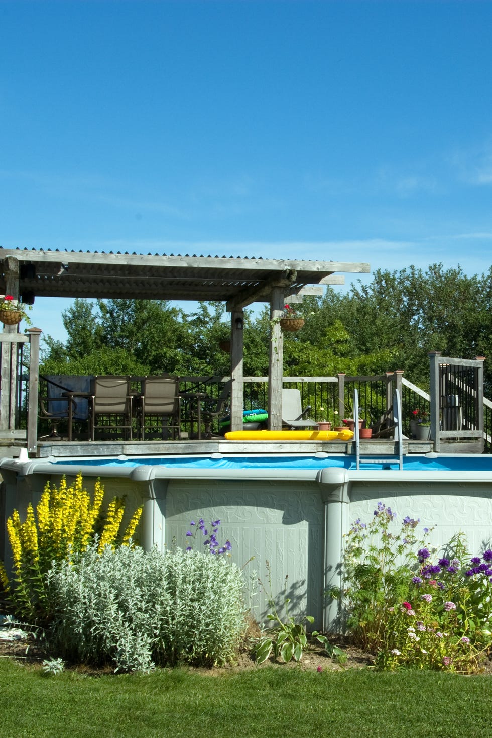 Pool and Deck a backyard deck and above ground swimming pool