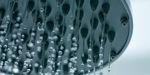 cloeup of a showerhead with frozen water dropletssee also