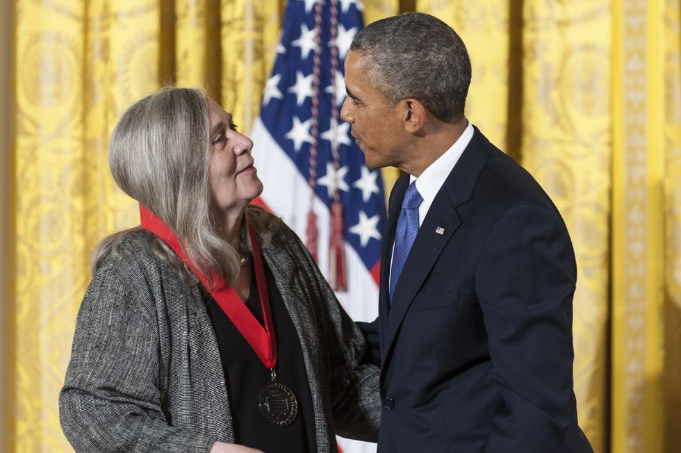 washington, dc   july 10  us president barack obama presents a 2012 national humanities medal to novelist marilynne robinson during a ceremony in the east room of the white house on july 10, 2013 in washington, dc robinson is recognized for her grace and intelligence in writing photo by pete marovichgetty images
