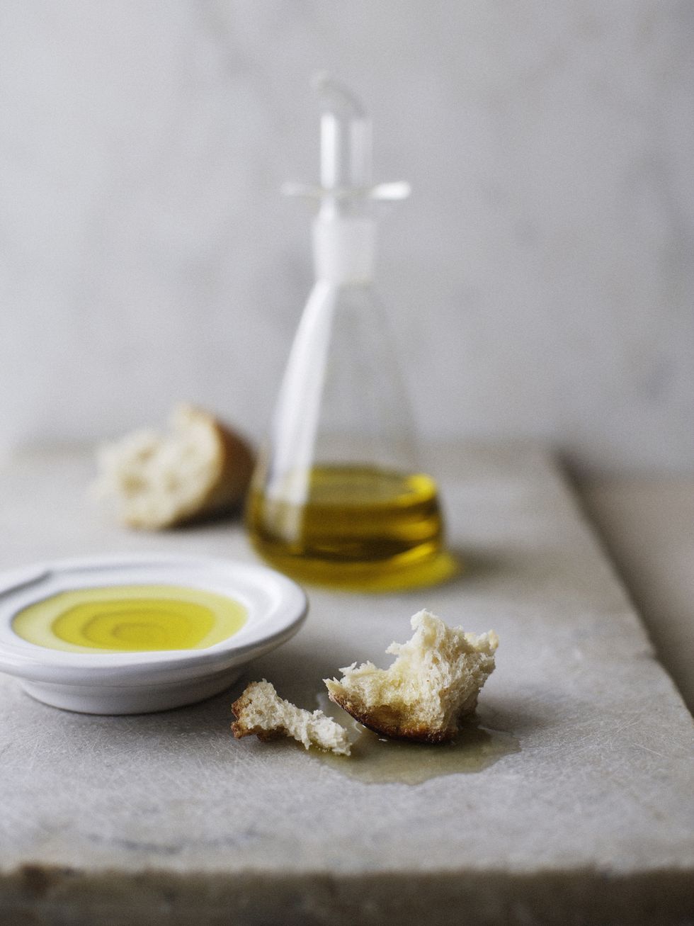 Plate of olive oil with crusty bread