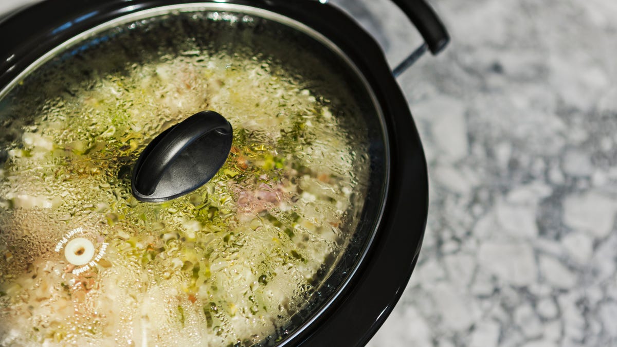 homemade split pea soup cooking in a slow cooker