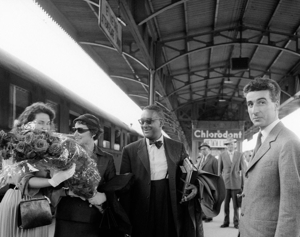 american writer richard wright and his wife ellen poplar welcomed at the rail station by some delegates of mondadori publishing house for the opening of the new factory verona, 1957 photo by emilio ronchinimondadori via getty images